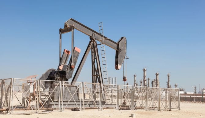 Oil production facility, heading an article on the Kuwait strike and oil prices