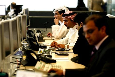Office employees in the UAE, heading an article on recruiting top talent