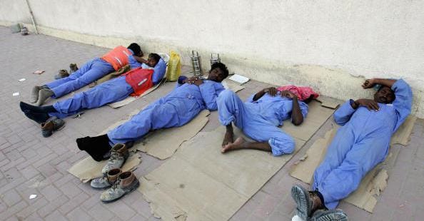 Construction workers in Dubai, heading an article on protecting Indian workers