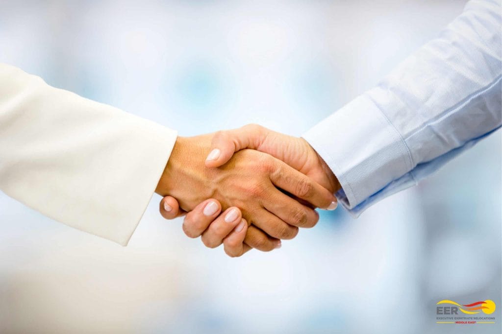 Two people shaking hands, heading an article on the UAE jobs outlook
