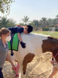 Picture to use Dubai World Cup racing, from an article on jockeys donating their riding fees to charity
